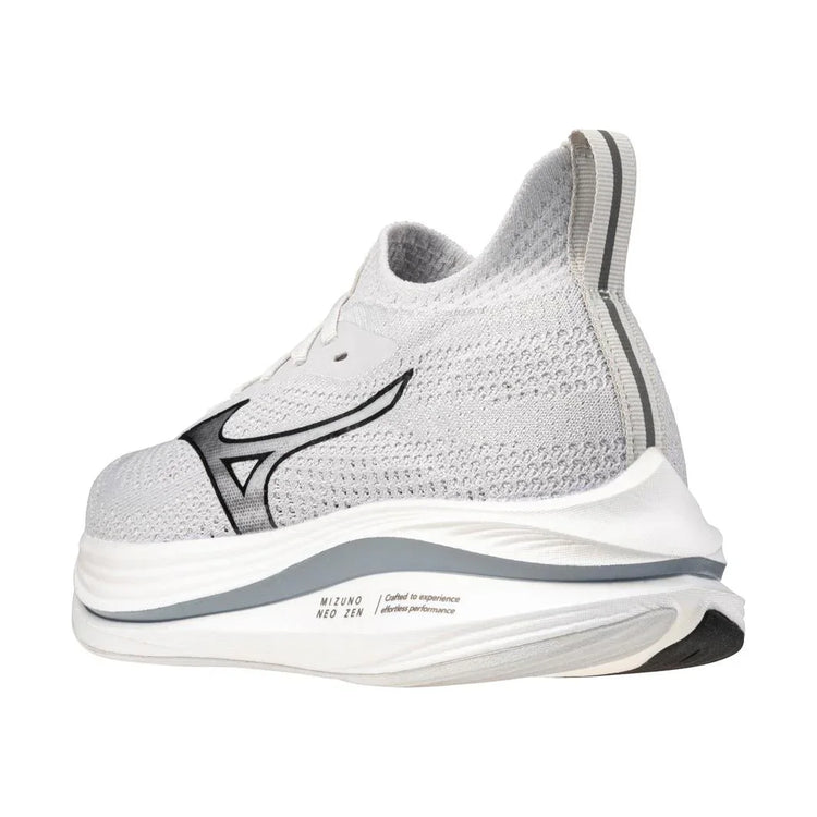 White athletic sneaker with black logo, mesh upper, and thick cushioned sole, side view