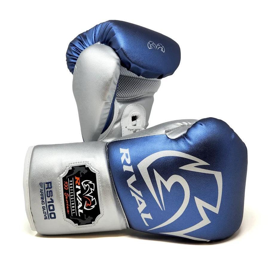 Blue and silver Rival RS100 boxing gloves with pro-grade sparring design on white background