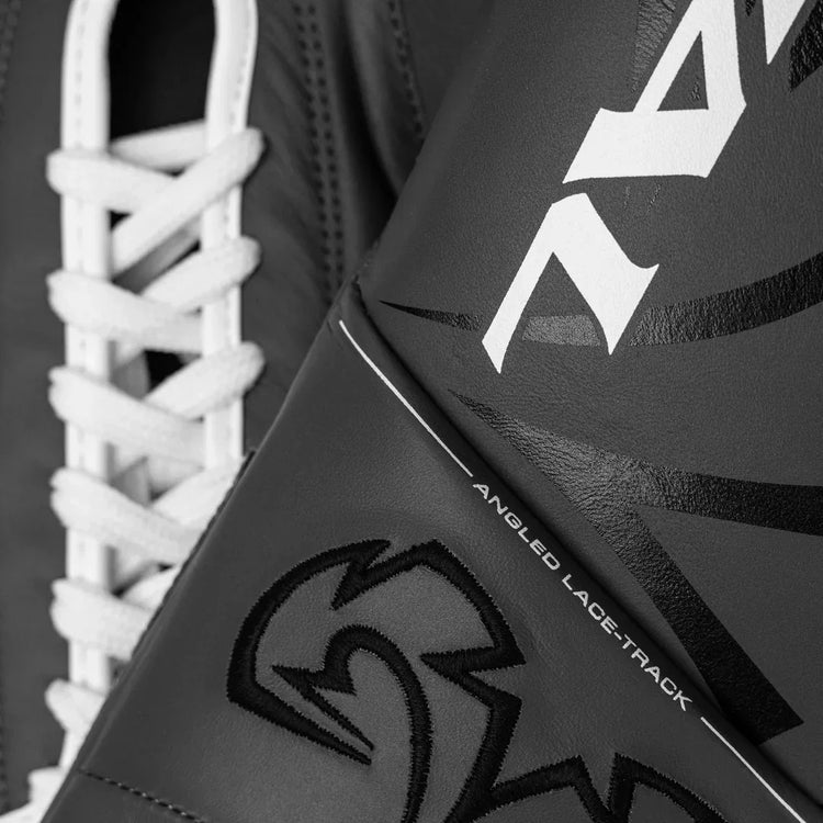 Close-up of black lace-up boxing glove with angled lace track and bold stitching